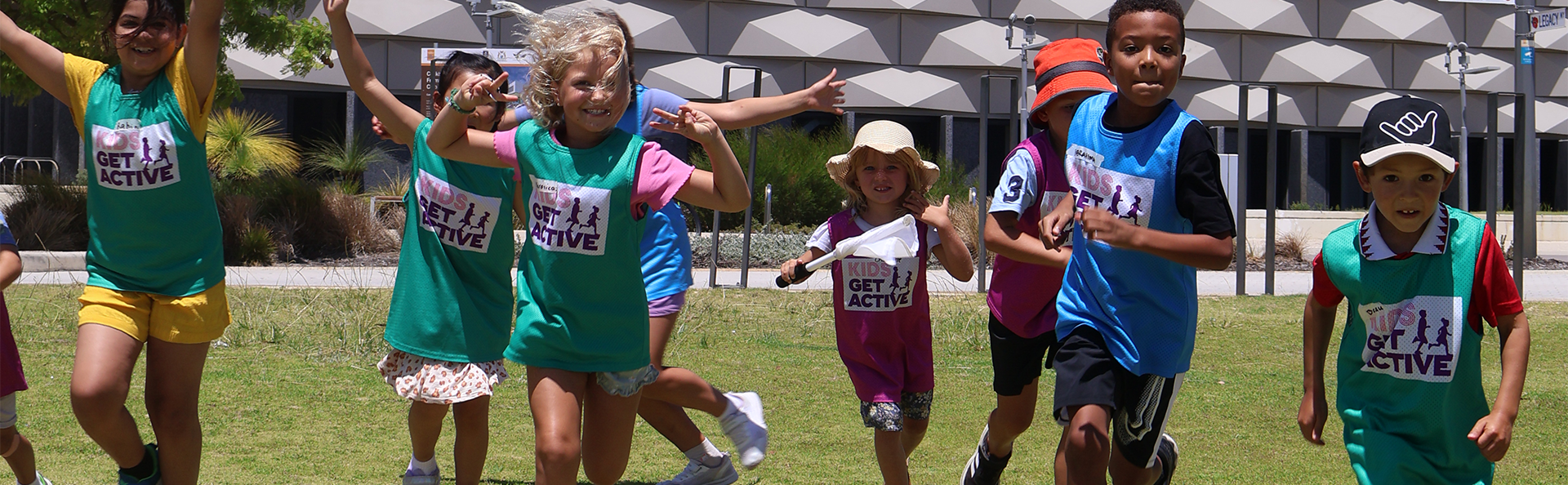 Kids from the holiday program running on lawn