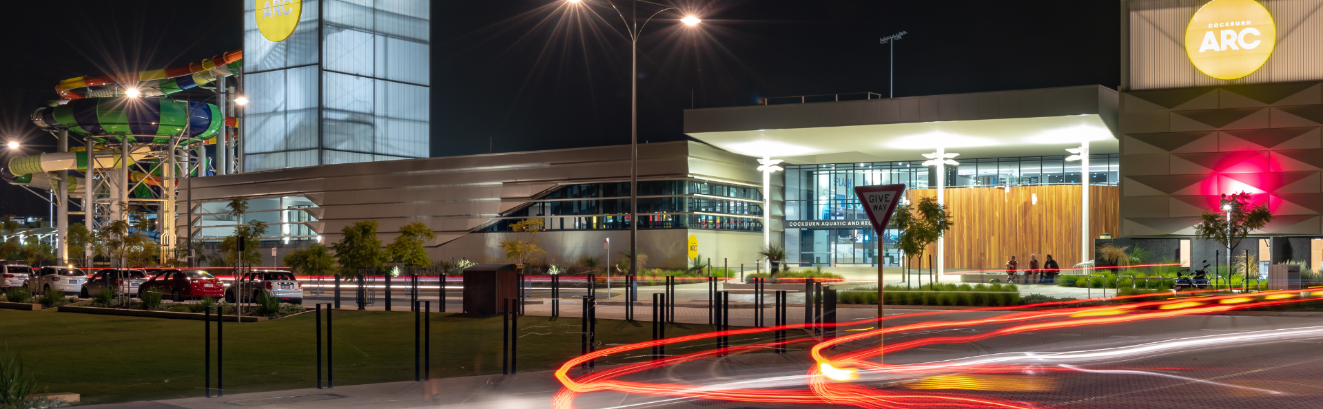 Outdoor image of the centre at night time.