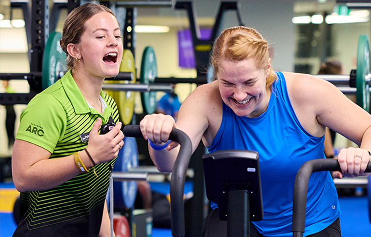 Women working out on a Airbike 