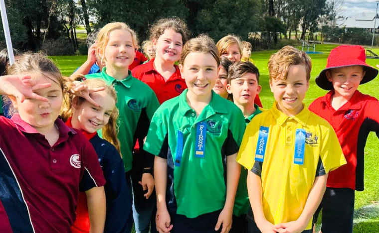 Kids smiling at the camera 