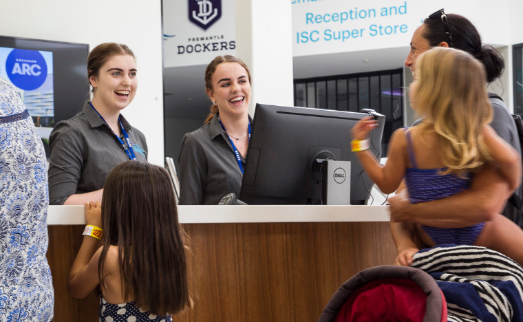 Patrons with staff at reception