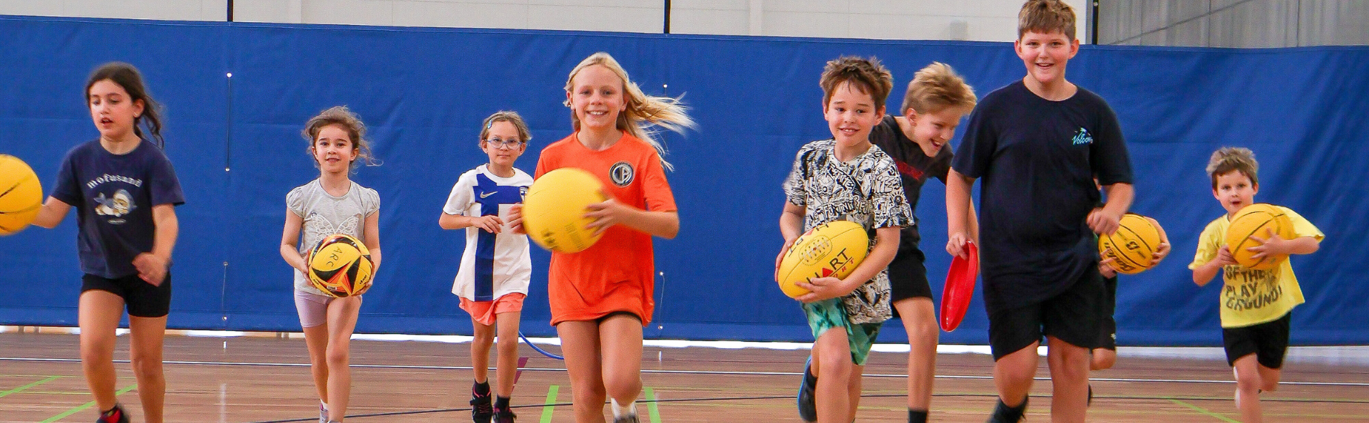Kids playing sports, running to the camera