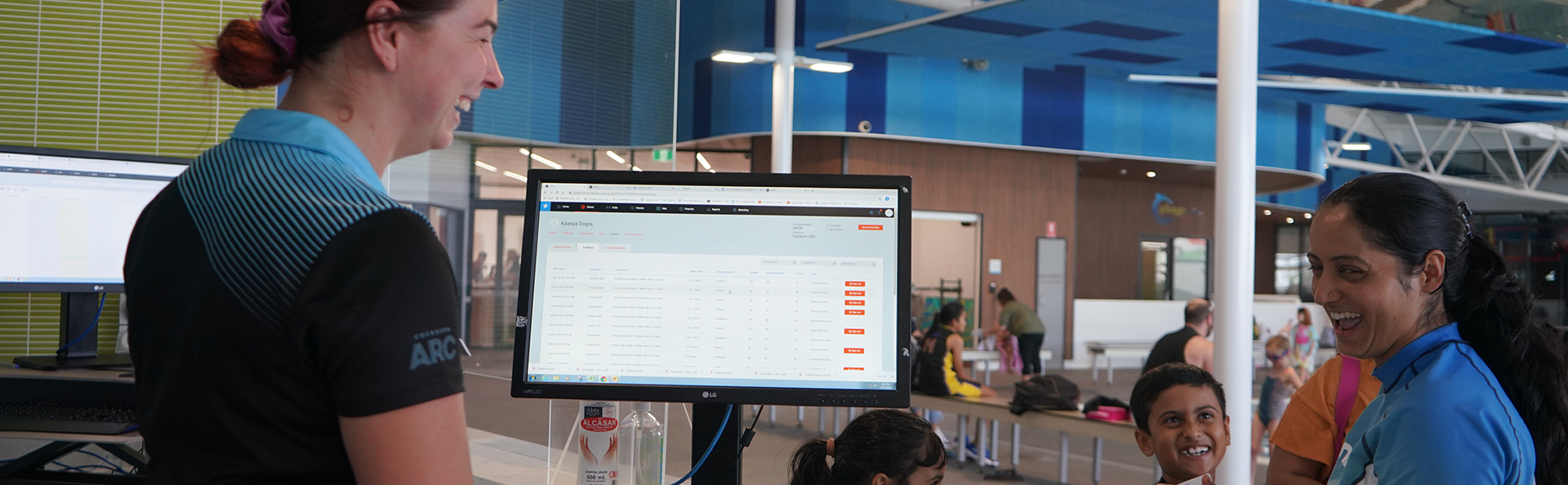 Staff helping enrolment manage