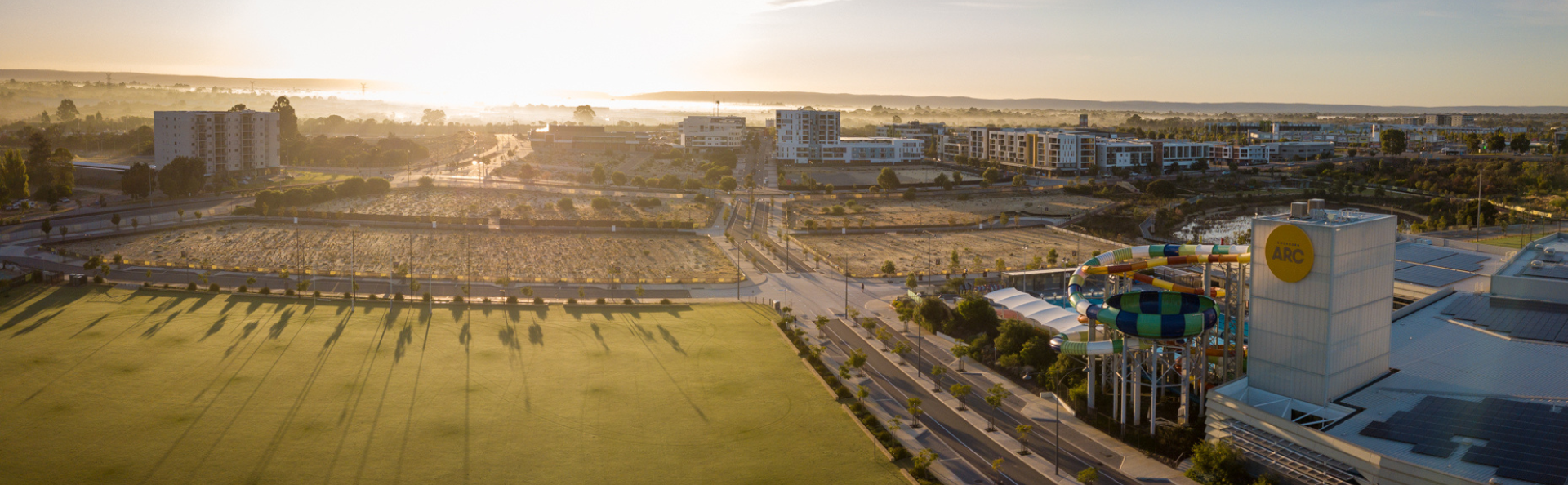 Wide sunrise view of the centre and surrounding areas.