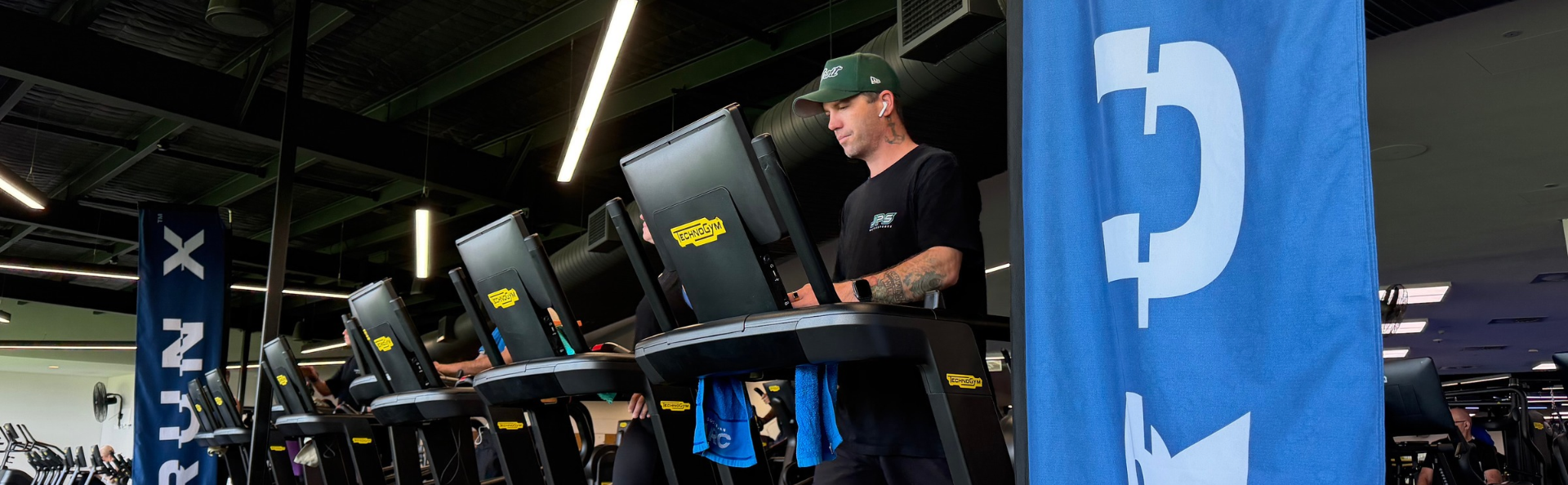 Members on TechnoGym Run X treadmills