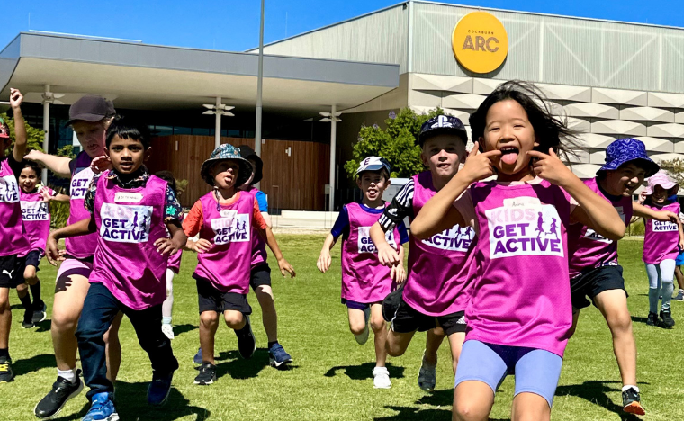 kids running on the oval, having fun.