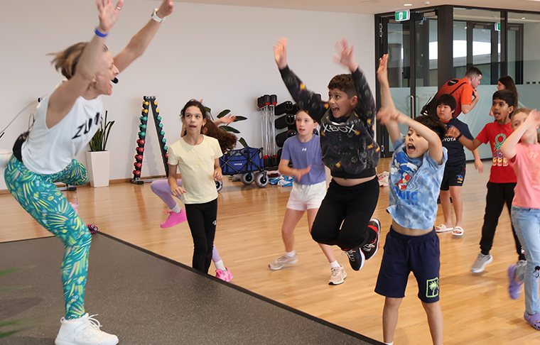 Kids following zumba dance moves