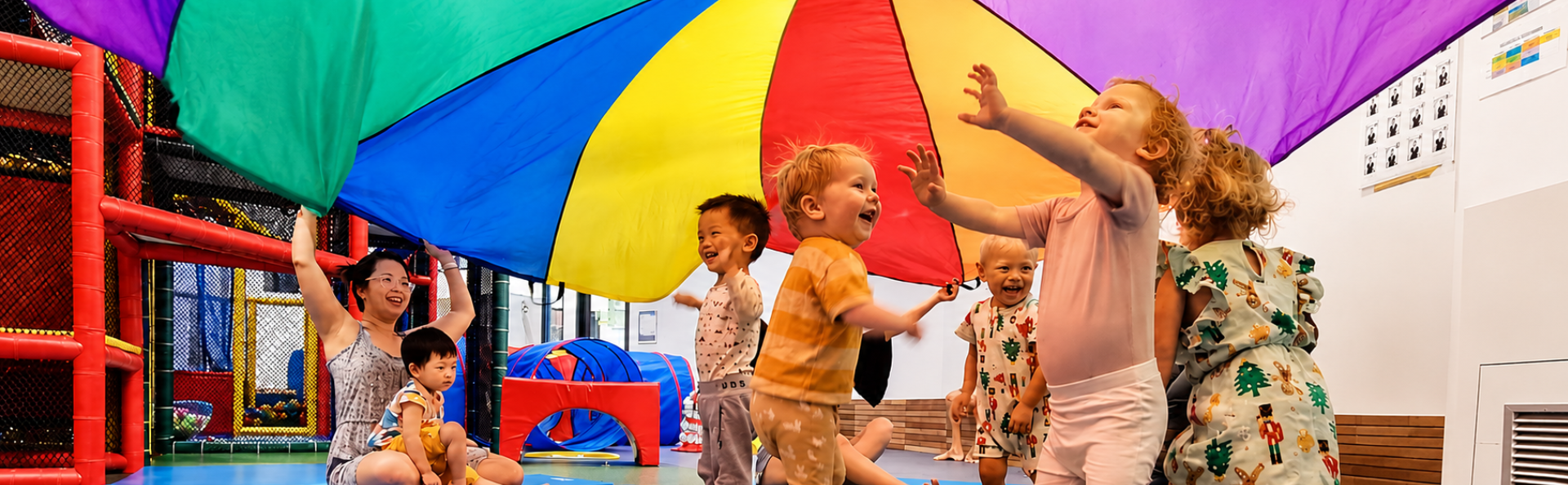 Children playing with their parents in a circle.