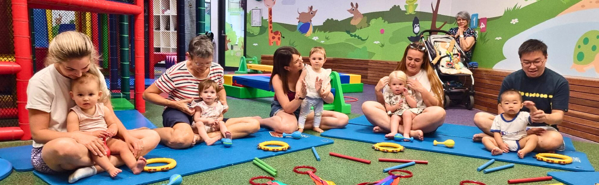 Children playing with their parents in a circle.