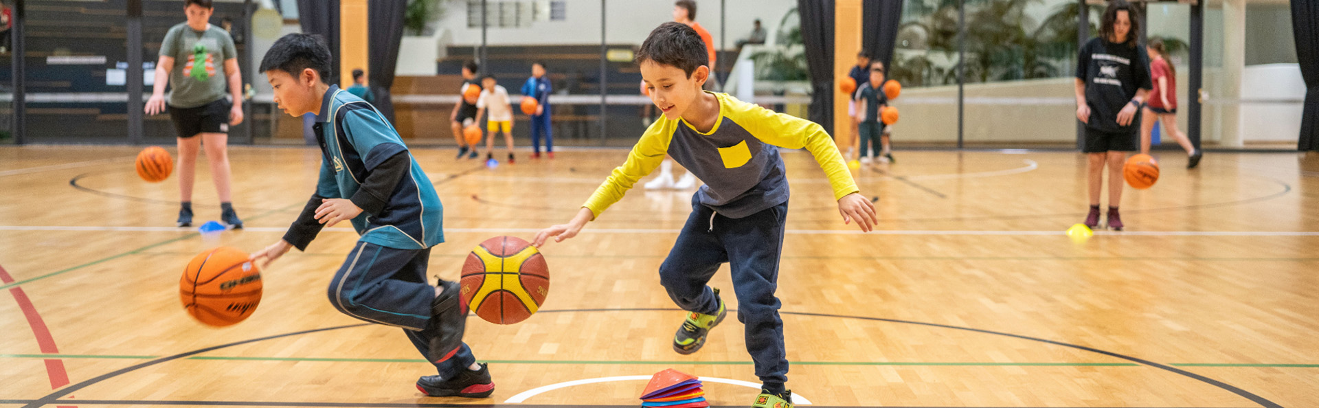 little boy bouncing basketball